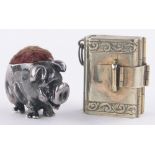 A miniature unmarked continental silver 4-fold fob photo locket in the form of a satchel,