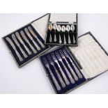 3 Cased sets of silver handled cutlery.
