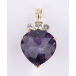 An 18ct gold amethyst and white sapphire heart shaped pendant, length excluding bale 22mm,