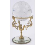 A 19th century crystal ball on ornate ormolu stand with mirrored base, ball diameter 7cm,