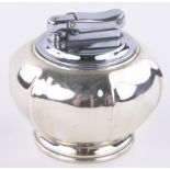 A silver Calibri table lighter, diameter 7cm.