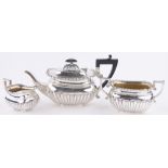 A late Victorian 3-piece silver teaset, of half fluted rectangular form by Alex Clark of London,