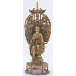 A Chinese gilt bronze seated Buddha, the arched back decorated in relief with temple figures,
