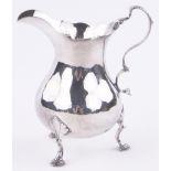 A George III silver cream jug of bulbous form, London 1791, height 11cm.