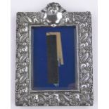 An Edwardian Art Nouveau embossed silver fronted photo frame, Birmingham 1901, makers marks H & A,