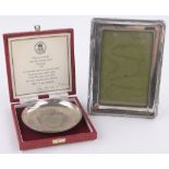 A Walker & Hall silver fronted photo frame, and a Winston Churchill Commemorative silver dish,