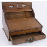 A Victorian oak writing slope/stationery cabinet, with tambour front and perpetual calendar,