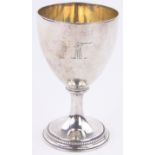 A George III silver goblet, with engraved armorial crest, on beaded circular foot,