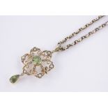 An Edwardian unmarked gold peridot & pearl set pendant on 9ct gold chain,