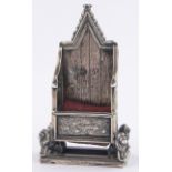 An Edwardian silver Coronation throne design pin cushion, makers marks L & S, Birmingham 1901,
