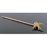 A 15ct gold pearl set swallow design stickpin.