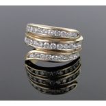 An 18ct gold diamond set triple row twist ring, set with 33 brilliant-cut diamonds,