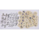 Quantity of French ivory gaming counters and a quantity of Victorian monogram inlay letters.