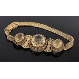A 9ct gold 3 stone citrine set bracelet, early 20th century, central panel height 22mm,