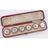 A cased set of Edwardian silver, enamel and mother of pearl buttons, Birmingham 1907 by Miller Bros.