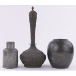 A 19th century Indian copper narrow necked vase and cover, with relief engraved geometric designs,