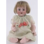 A 19th century Simon & Halbig bisque headed doll, with composition body, height 28cm.