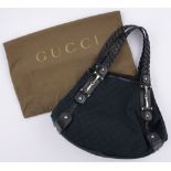 A modern Gucci leather and fabric monogram design black handbag, original dust bag.