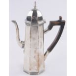 An Edwardian silver coffee pot in Queen Anne style, of tapered octagonal form, makers marks F H,