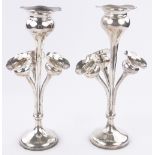 A pair of Edwardian silver trumpet shaped table centre epergnes, each with 3 smaller trumpets below,