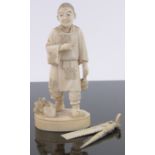 A 19th century Chinese carved ivory okimono, man drinking sake, signed with seal under base,