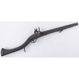 An Antique Middle Eastern flintlock rifle, length 84cm.