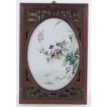 A Chinese painted porcelain plaque, depicting locus and exotic flowers, text inscription,