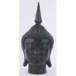 An Oriental bronze Buddha head, height 37cm.