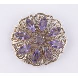 An ornate 9ct gold amethyst set circular brooch, 35mm across, 12.1g.