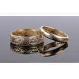 A 19th century unmarked gold engraved band ring, dated 1881, size R, 3.9g and a 22ct wedding band 4.