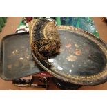 A Victorian oval lacquered tray with floral decoration and a Japanese design lacquered papier maché