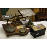 Postal scale and weights and a lacquer tea caddy with painted lid.