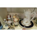 Various figures, coffee pot and plates.