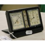 A leather cased Le Coultre travel clock, thermometer and barometer.