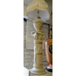 A Classical design table lamp with swag decoration and shade on similar plinth with embossed