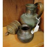 A prayer wheel, a bronze jug and an embossed copper pot, (3).