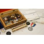 A carved Indian box containing Royal memorabilia, penknives,