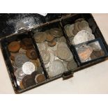 A tin of various British and continental coins,