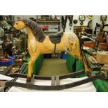 Antique carved and painted wood rocking horse.