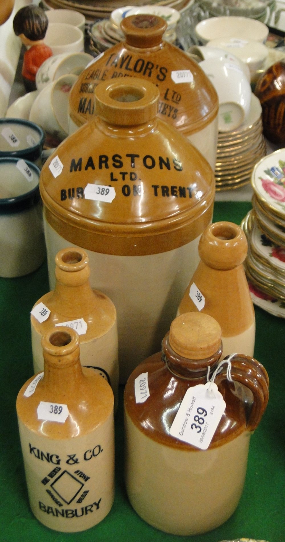 Stoneware flagons and ginger beer bottles.