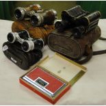 A pair of Antique leather cased binoculars,