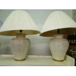 A pair of table lamps and shades.