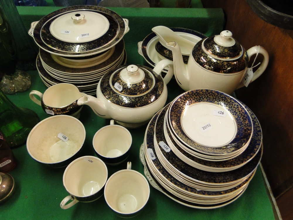 Washington Pottery dinner service and matching teaware including teapot and coffee pot.