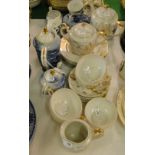 A Japanese eggshell porcelain teaset and a coffee set, both with lithophane lady decoration.