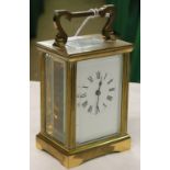 A brass cased carriage clock.