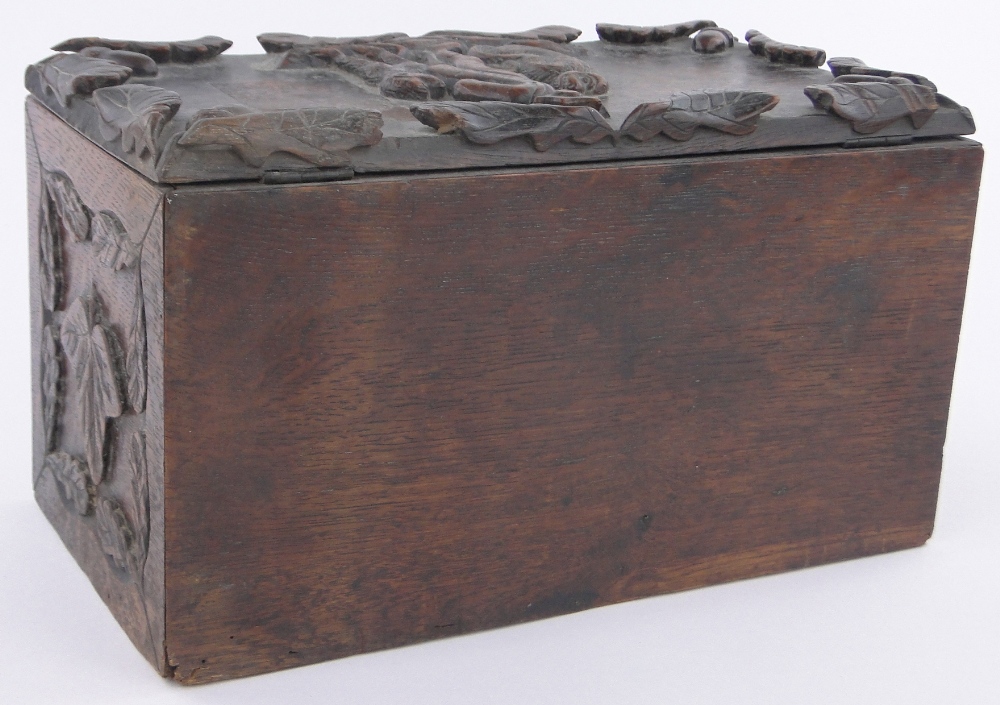 A 19th century rectangular oak box, relief carved with anthropomorphic studies of monkeys and dogs, - Image 2 of 3