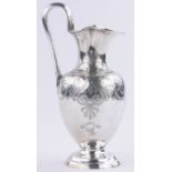 A Victorian silver ewer, engraved classical style scroll decoration with Ramsey armorial crest,