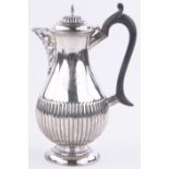 A Victorian silver half fluted hot water jug, London 1896, 15.5 oz, height 22cm.