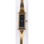 A lady's Gucci 1500L gold plated bangle wristwatch, black dial, case width 12mm, boxed,