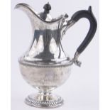 A silver hot water jug, makers marks S H & Co., Sheffield 1930, 21.67 oz, height 22cm.